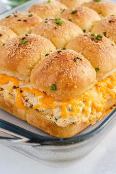 there is a sandwich with cheese and meat on it in a glass casserole dish