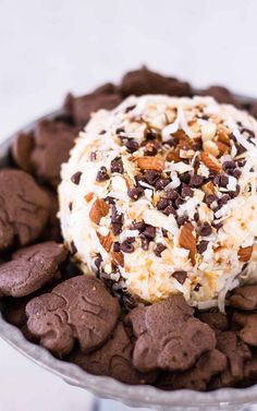 a bowl filled with chocolate covered cookies and nuts