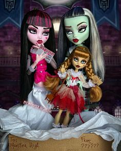 three dolls are posed together in front of a sign that says, monster high?