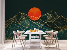 a dining room table with four chairs and a wall mural