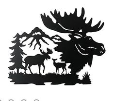 the moose and deer are silhouetted in front of some trees, with mountains behind them