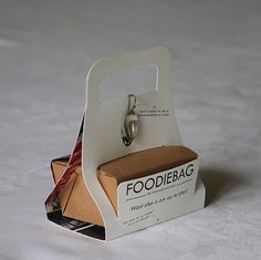 an open foodie bag sitting on top of a cardboard box