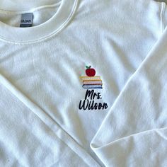 Books Stacked, Teacher Sweatshirt, Personalized Teacher Gifts, Teacher Name, Apple Books, The Way Home, Embroidered Clothes, Embroidered Sweatshirt, Embroidery Ideas