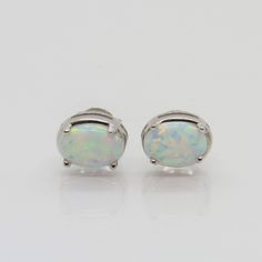 Vintage Sterling Silver Oval White Opal Stud Earrings ...Marked 925...Total of weights 1.5grams...Measure of stone 7 x 5MM...These are very good condition. Silver Oval Earrings, White Oval Earrings, Classic Nickel-free Oval Earrings, White Sterling Silver Oval Earrings, Vintage White Oval Earrings, Vintage Nickel-free Oval Earrings, Nickel-free Oval Opal Jewelry, Vintage Turquoise And Sterling Large Oval Stud Earrings, White Opal Stud Earrings