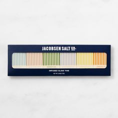 the jacoben salt pencils are lined up in a row on a white surface