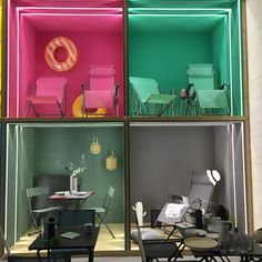 four different colored rooms with chairs and tables in each one's windows, all showing the same color scheme