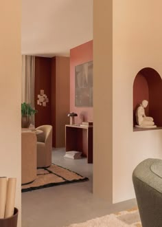 a living room filled with furniture and a vase on top of a table in front of a window