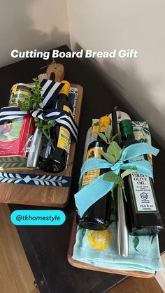 two wooden trays filled with different types of items on top of a table next to each other