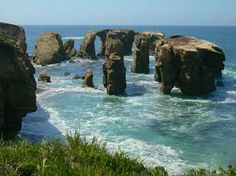 the ocean is full of rocks that look like they have been carved into the water