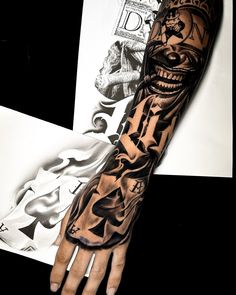 a man's arm with tattoos on it and a skull in the middle of his arm