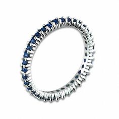 an image of a ring with blue stones on it