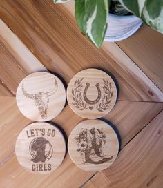 three wooden coasters with the words let's go girls on them