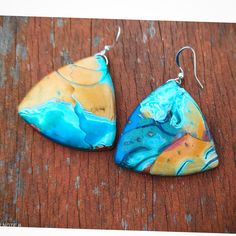 "Modern polymer clay pendant earrings  in blue and bronze shades. I got inspired by the synergy between heaven and earth to make this pendant. This unique polymer clay earrings are part of my 'Colors : Turquoise' collection, created using Mokume Gane polymer clay technique. The Width of choker is 1.5\" (3.5 cm)  The  length of pendant is 1.5\" ( 3.5 cm) You are invited to explore more art jewelry necklaces at my shop: https://www.etsy.com/il-en/shop/GlArtJewelry?ref=hdr_shop_menu&section_id=1925 Handmade Blue Polymer Clay Earrings, Artistic Hand Painted Polymer Clay Earrings, Handmade Blue Resin Earrings, Handmade Artistic Blue Earrings, Unique Hand Painted Turquoise Earrings, Unique Hand Painted Blue Earrings, Hand Painted Artsy Polymer Clay Jewelry, Artsy Hand Painted Polymer Clay Jewelry, Handmade Turquoise Resin Earrings