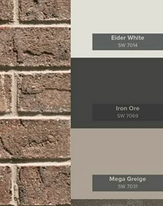 a brick wall with different shades of gray and white on the top, from left to right