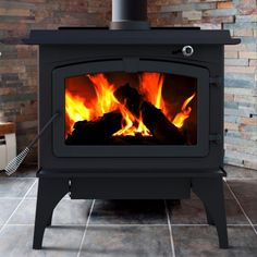 a black stove with fire burning in it