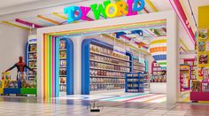 the interior of a toy store with brightly colored walls and shelves filled with children's toys