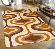 a living room area with a rug, chair and coffee table on the floor in front of it