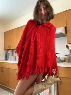 Poncho is a one size fits all size. Vintage Winter Poncho One Size, One Size Vintage Poncho For Winter, Vintage One-size Winter Poncho, Red Winter Cape One Size, Casual One Size Knit Poncho, Red Long Sleeve Poncho, One Size, Red Oversized Poncho For Winter, Oversized Red Poncho For Winter, Casual Red Long Sleeve Poncho