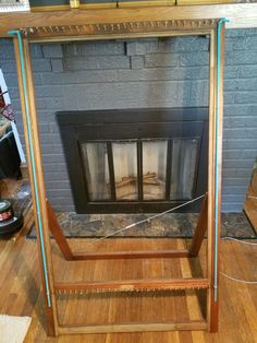 a fire place sitting on top of a hard wood floor