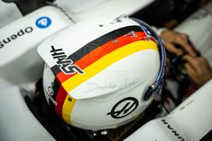 a helmet is sitting on top of a race car's driver's seat