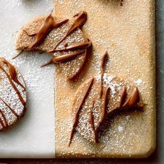 chocolate desserts on a cutting board with powdered sugar