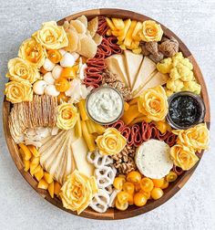 a wooden platter filled with different types of food