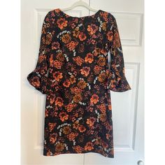 Karl Lagerfeld Size 6 Excellent Condition, Never Worn New Without Tags Orange Floral Pattern Peplum Sleeve Zip Up Back Black Printed Mini Dress For Fall, Black Printed Dress For Fall, Orange Fall Workwear Dress, Orange Workwear Dress For Fall, Orange Dress For Fall Workwear, Fall Season Orange Workwear Dress, Orange Mini Dress For Work, Black Floral Print Mini Dress For Work, Black Floral Print Dress For Work