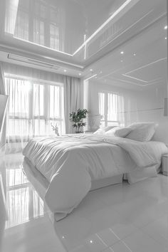 black and white photograph of a large bed in a room with lots of windows on both sides