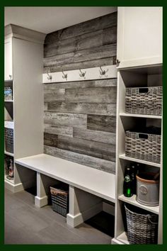 a room that has some shelves and baskets on the wall next to each other in it