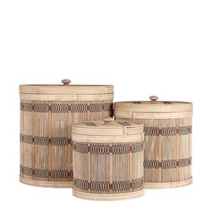 three round baskets with handles made out of bamboo