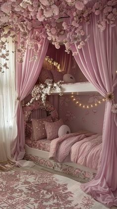 a bedroom decorated in pink and white with flowers on the ceiling, bedding and curtains