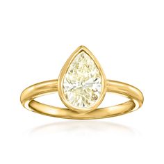 a pear shaped diamond ring in yellow gold