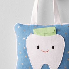 a tooth shaped bag hanging on the wall