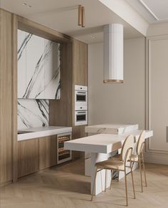 a modern kitchen with marble counter tops and white appliances