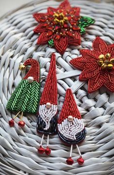 several christmas decorations are sitting in a basket on top of wickers and beads