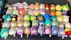 the stuffed animals are all different colors and sizes