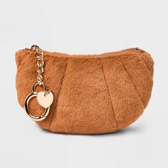 Add a standout piece to your bag collection with the Faux-Fur Croissant Clip-On Pouch from A New Day™. This brown pouch is designed in the shape of a croissant with a single compartment to help provide ample space for your cosmetics and other items. Designed with faux fur, this clip-on pouch includes a zipper closure to help keep the contents secure. A New Day™: Style that goes wherever you do. Faux Fur Top, Bag Collection, Bag Clips, Handbag Straps, Coin Pouch, A New Day, Clutch Handbag, You Bag, Handbag Accessories