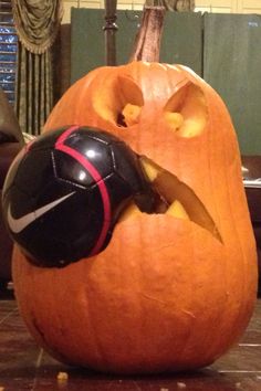 a pumpkin carved to look like a soccer ball