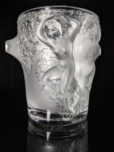 a glass vase with an image of a naked woman on it's body in the center