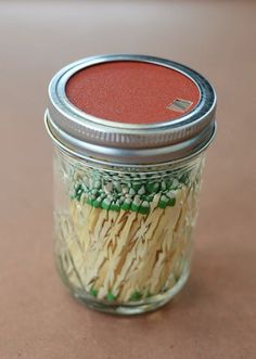 a jar filled with pasta sitting on top of a table