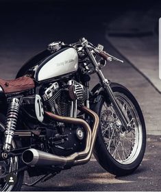 a black and white motorcycle parked on the street