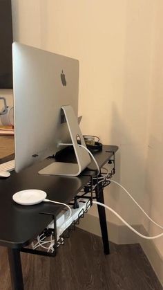 an apple computer sitting on top of a desk