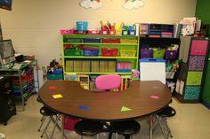 a classroom with desks and chairs in it