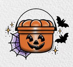 a halloween basket with pumpkins and bats on the side, in front of a white background