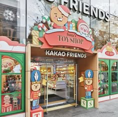 the store front of toy shop with teddy bears on display