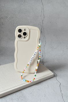 Add a y2k style touch to your phone and make it more personal. Whether you want to write a name or initial on the strap, this Frost Beaded Phone Charm Strap in y2k style will surely turn heads. With these colourful beaded phone straps, you don't have to worry about forgetting your phone somewhere else! SIZE ⭐️ Approx 36 cm  STYLE ⭐️ Comes in different thread colour and size options ⭐️It can be customized so you can choose your own words or name on it and you can even choose the thread colour. ⭐️ Phone Wrist Strap, Beaded Phone Strap, Phone Straps, Phone Plug, Phone Strap, Cute Packaging, Phone Charm, Y2k Style, Bag Tags