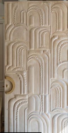 an artisticly designed wall panel in white