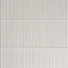 a white wall with vertical lines painted on it