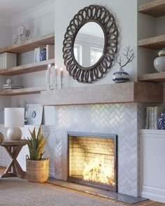 a living room filled with furniture and a fire place in front of a round mirror