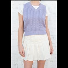 Classic Cable-Knit Sweater Vest With A High V-Neck. Fabrics: 100% Cotton Measurements: 19" (48 Cm) Length, 16" (41 Cm) Bust Made In: Italy Preppy V-neck Tops For Fall, Casual Fitted Cotton V-neck Sweater, Spring Preppy Cotton Sweater, White Preppy Knit Tops, White Knit Preppy Tops, Preppy Cotton V-neck Sweater, Fitted Knit V-neck Sweater Casual Style, Casual Fitted Knit V-neck Sweater, Fitted Cotton V-neck Sweater Vest